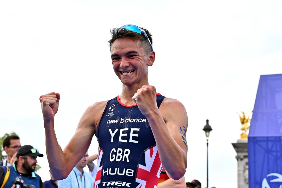 Alex Yee celebrates after winning the Paris Olympics triathlon test event