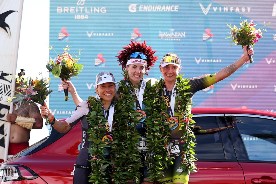 L-R: Anne Haug (2nd), Lucy Charles-Barclay (1st) and Laura Philipp (3rd) celebrate on the 2023 Ironman World Championship podium, in Kailua Kona, Hawaii