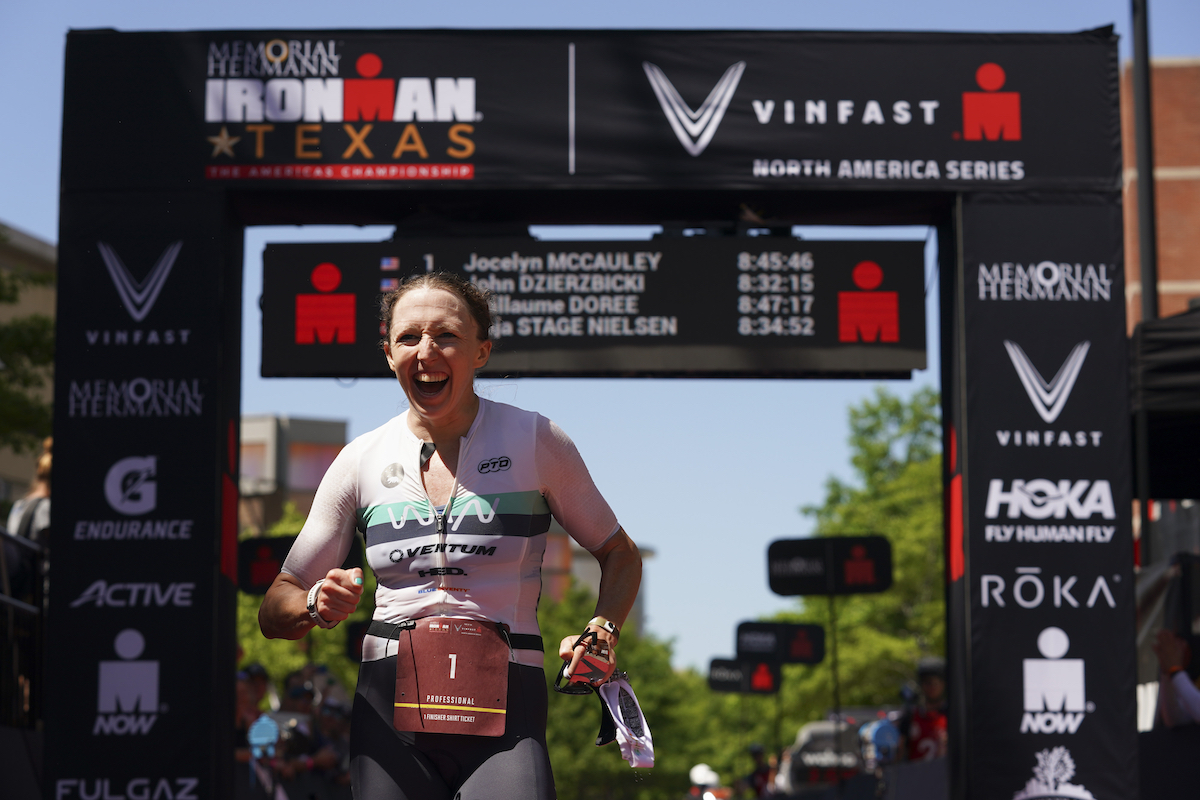 American pro triathlete Jocelyn McCauley celebrates finishing third at the 2023 Ironman Texas