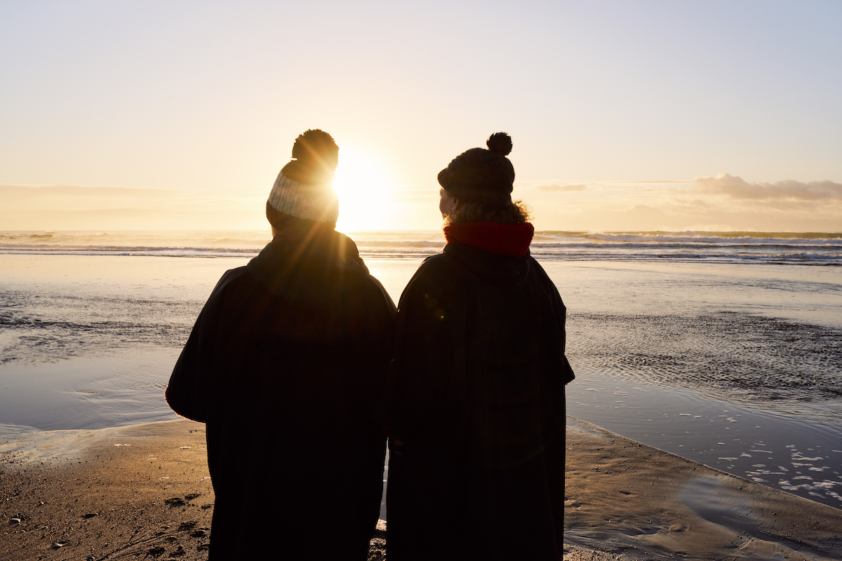 People wearing swim robes after a swim