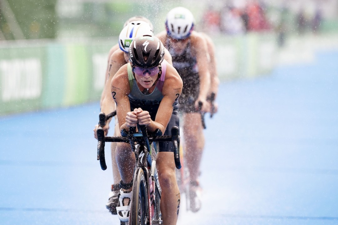 Bermudan triathlete Flora Duffy on the bike leading the 2020 Tokyo Olympic Games women's triathlon