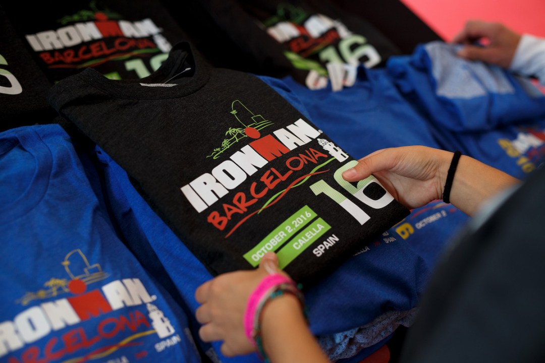 A worker folds a T-shirt at a shop a day before Ironman Barcelona on October 1, 2016 in Calella, near Barcelona, Spain.