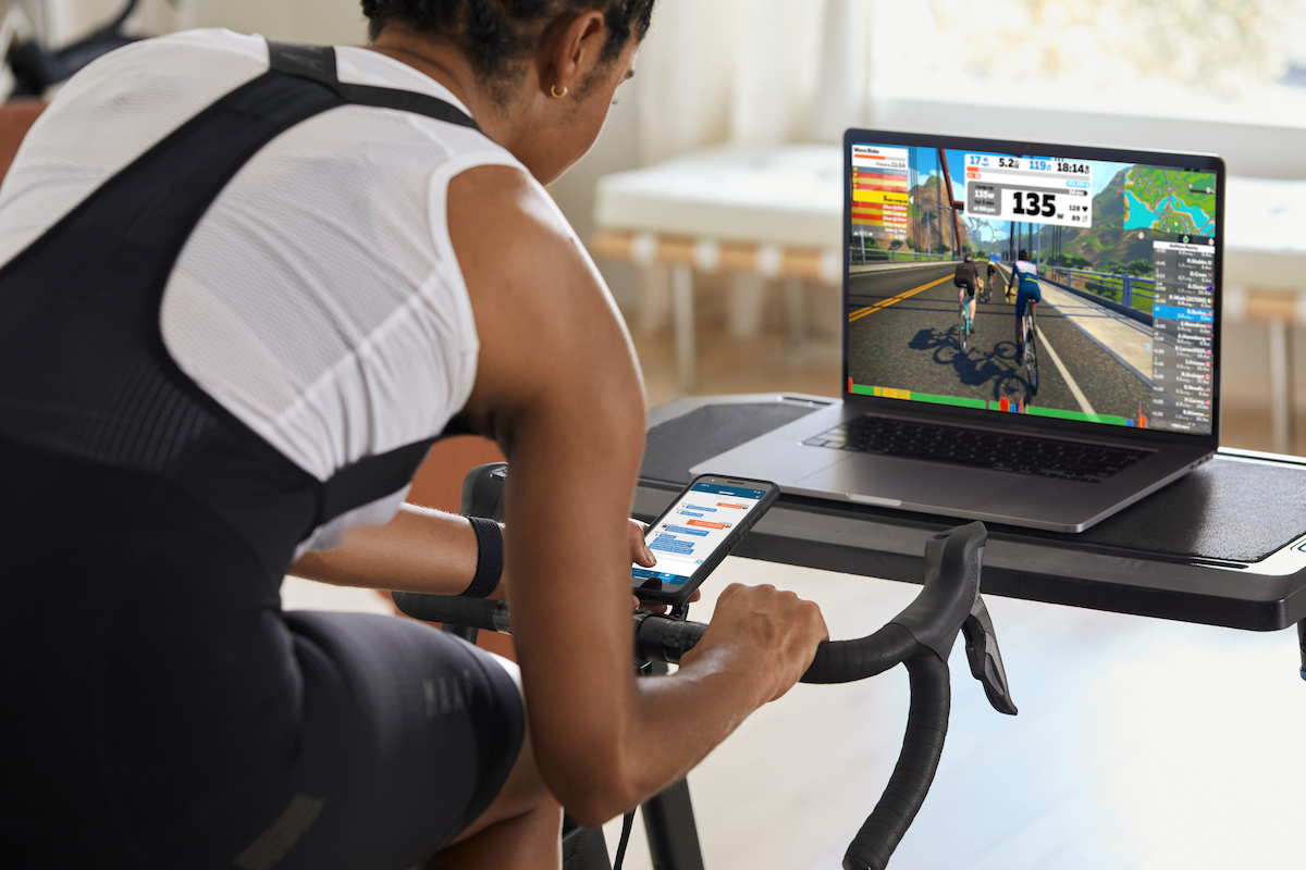 Woman using Zwift on laptop