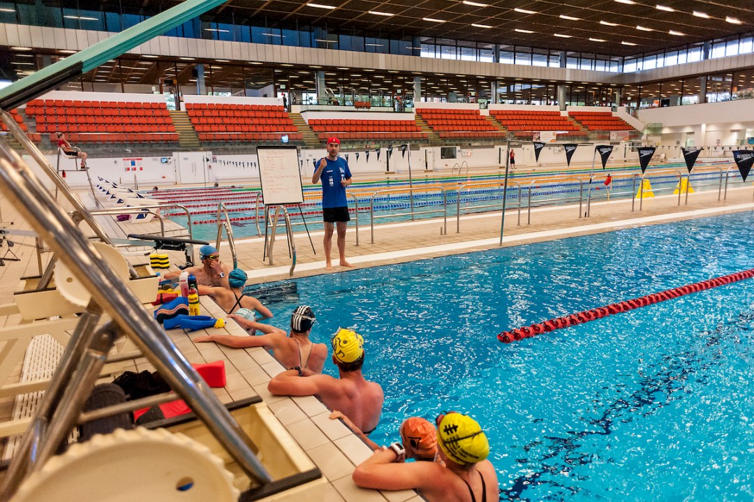 Swimmers being coached in a swim session