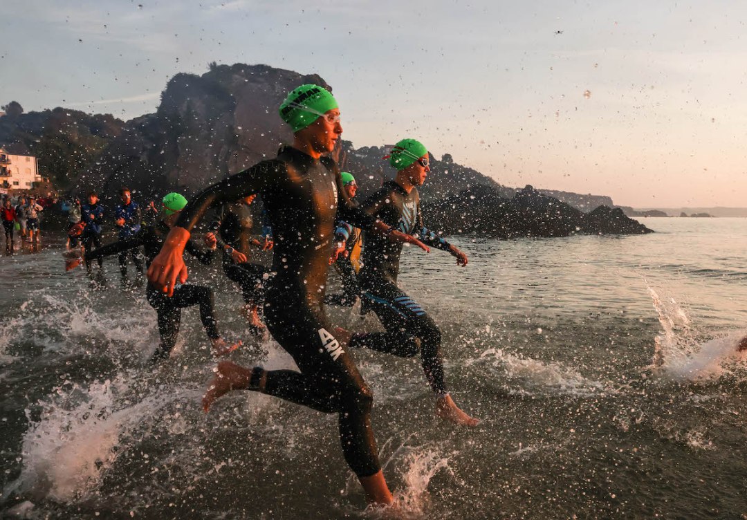 Triathletes start the swim at Ironman Wales