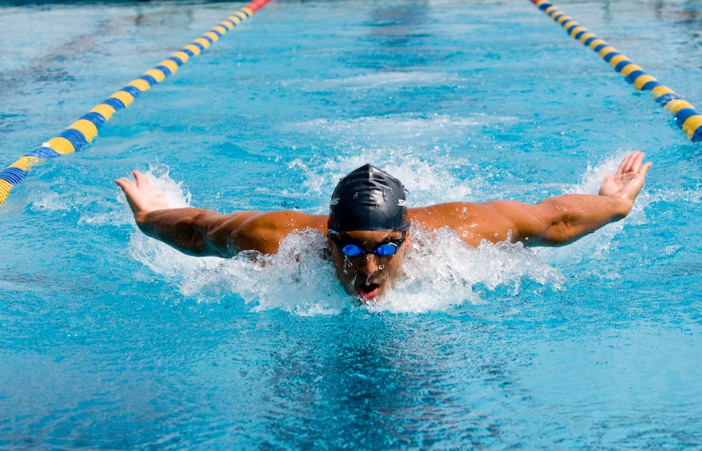 Man performing butterfly in the pool