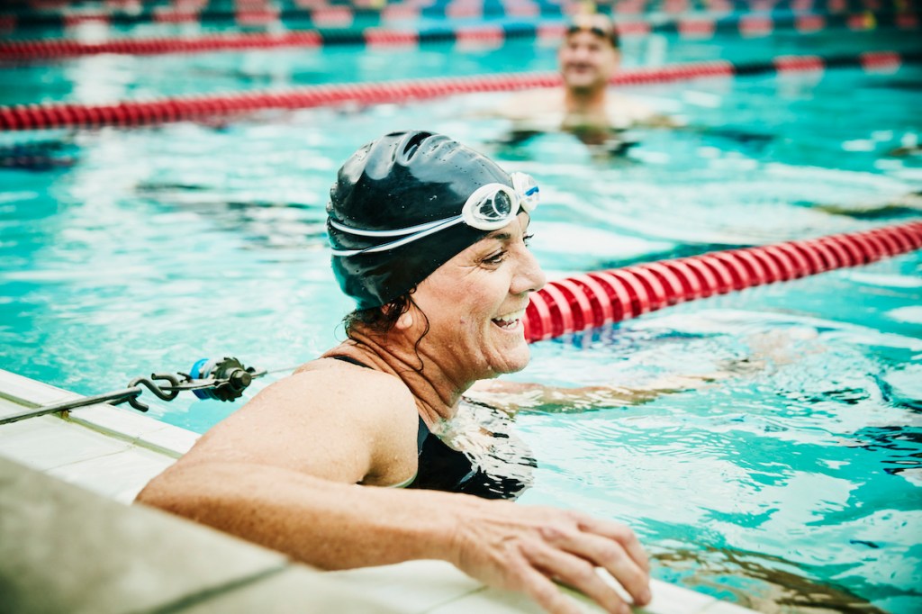 Woman thinking how many calories does swimming burn