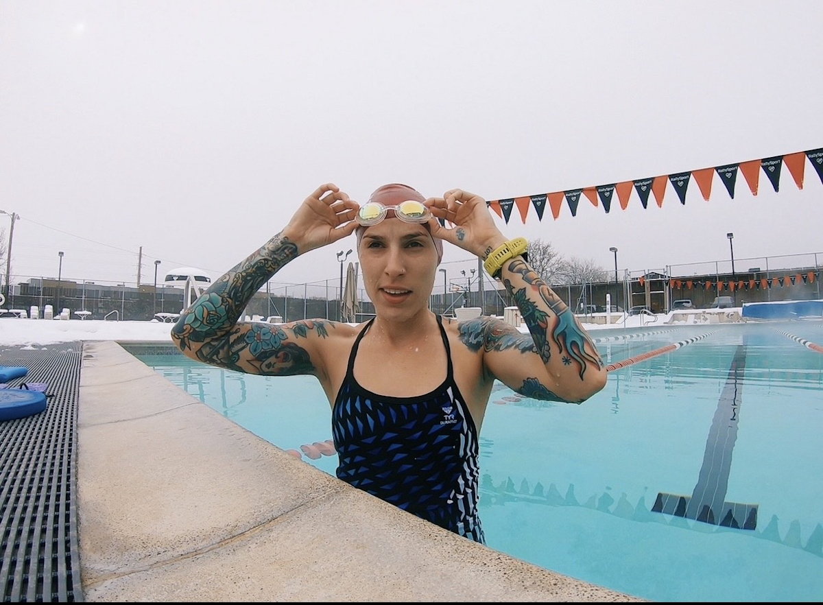 Cori James tattoo artist in a swimming pool