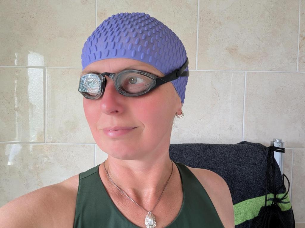 Female swimmer wearing TheMagic5 goggles in Clear Magic
