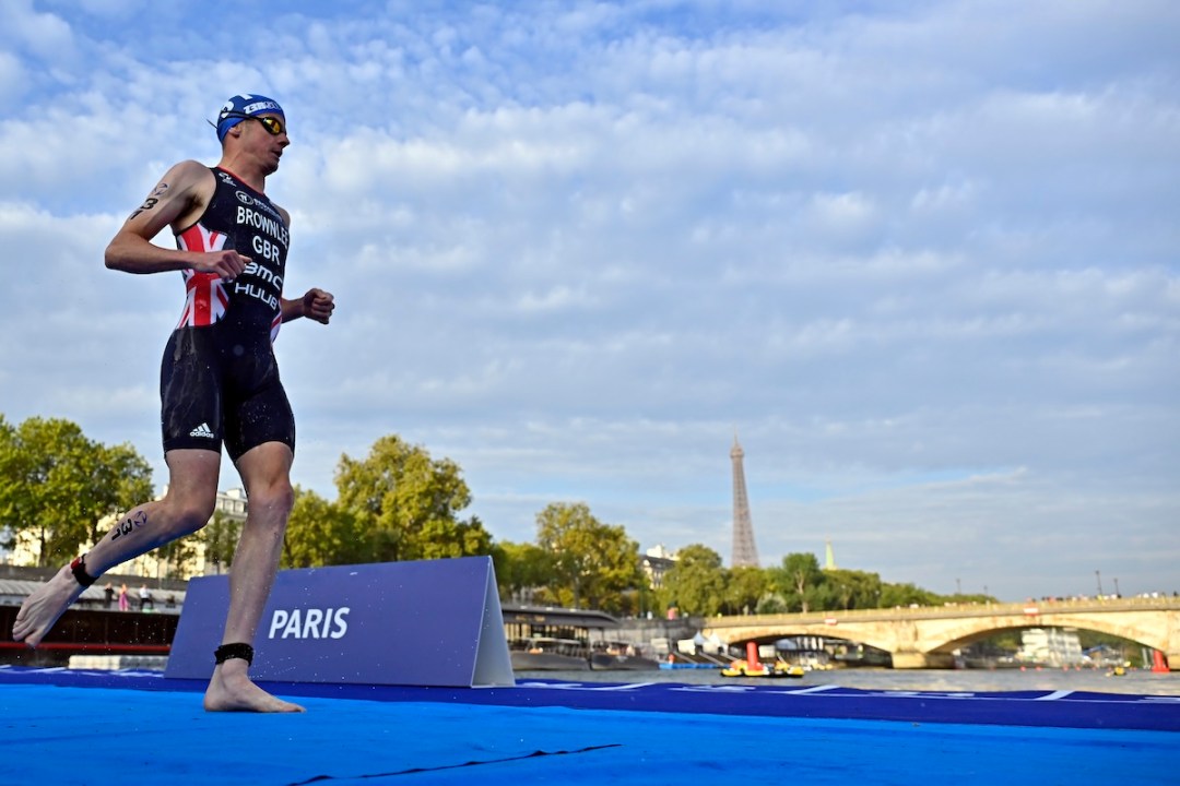 Jonny Brownlee competes on the starting line in front the Eiffel Tower before the Men's World Triathlon Championship Series on August 18, 2023 in Paris, France.