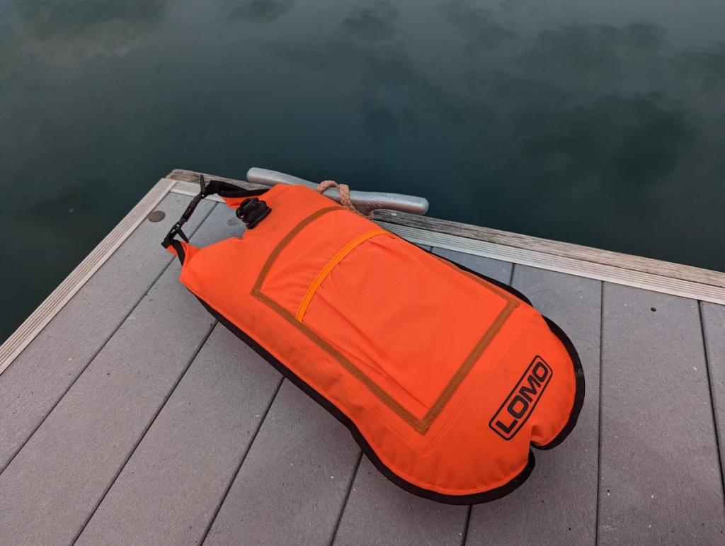 Lomo Dry Bag Float inflated and on the jetty by a lake