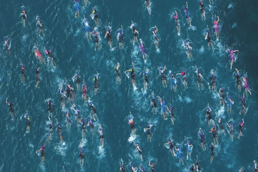 Athletes swimming in an Ironman