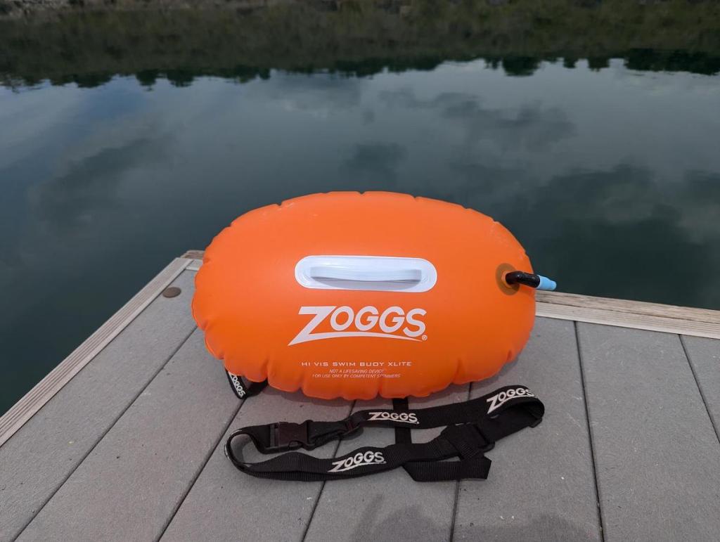 Zoggs Hi Viz Tow Float on a jetty by a lake