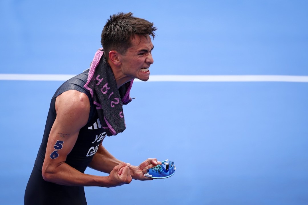 Alex YEE of Great Britain celebrates as he won the Gold Medal after the Men's Individual Triathlon on day five of the Olympic Games Paris 2024 at Pont Alexandre III on July 31, 2024 in Paris, France.