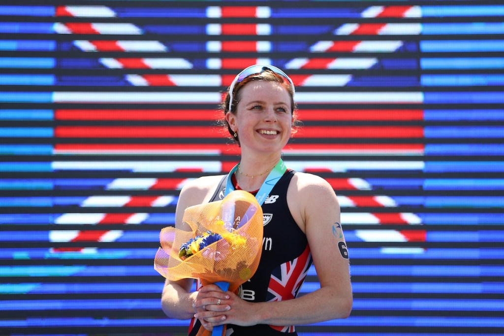 GB triathlete Georgia Taylor-Brown on the podium having won the 2023 Cagliari WTCS race