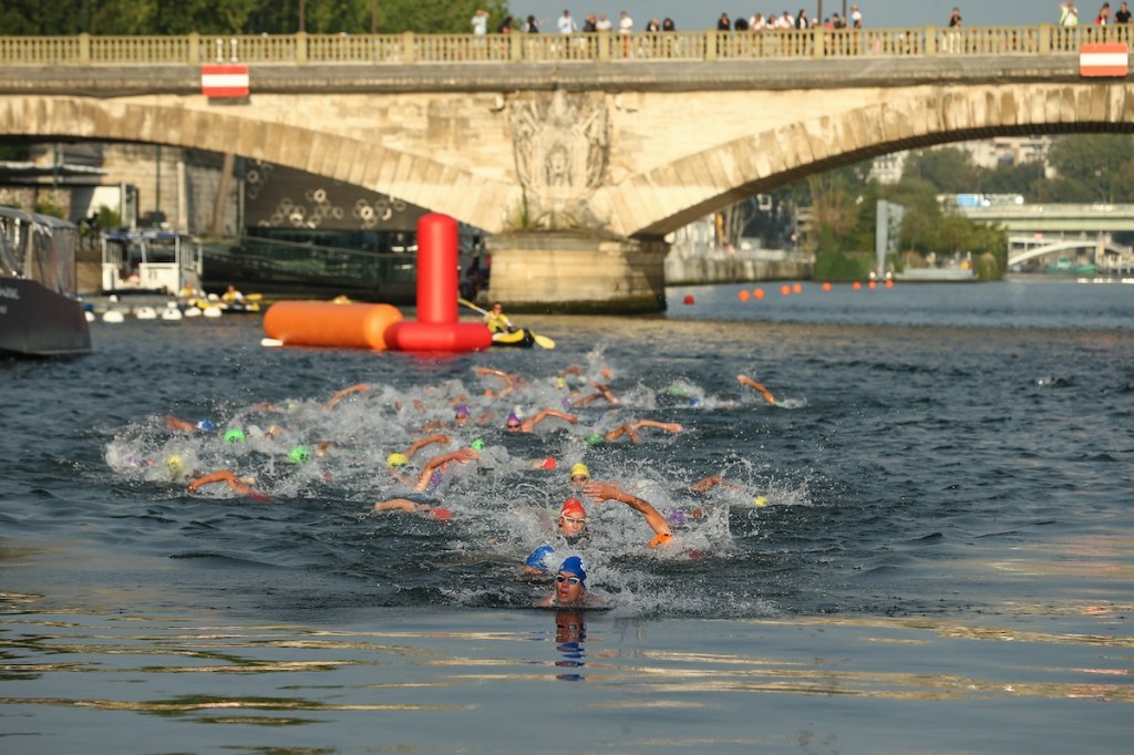 Male elite triathletes compete in the swim leg of the 2023 Paris Olympics triathlon test event