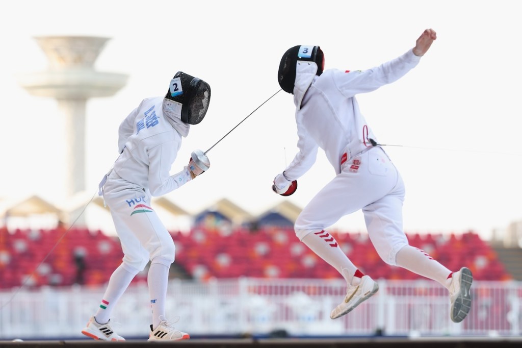 Balazs Szep (L) of Hungary competes against Kamil Kasperczak of Poland in the 2024 Pentathlon World Championships at Zhengzhou, China