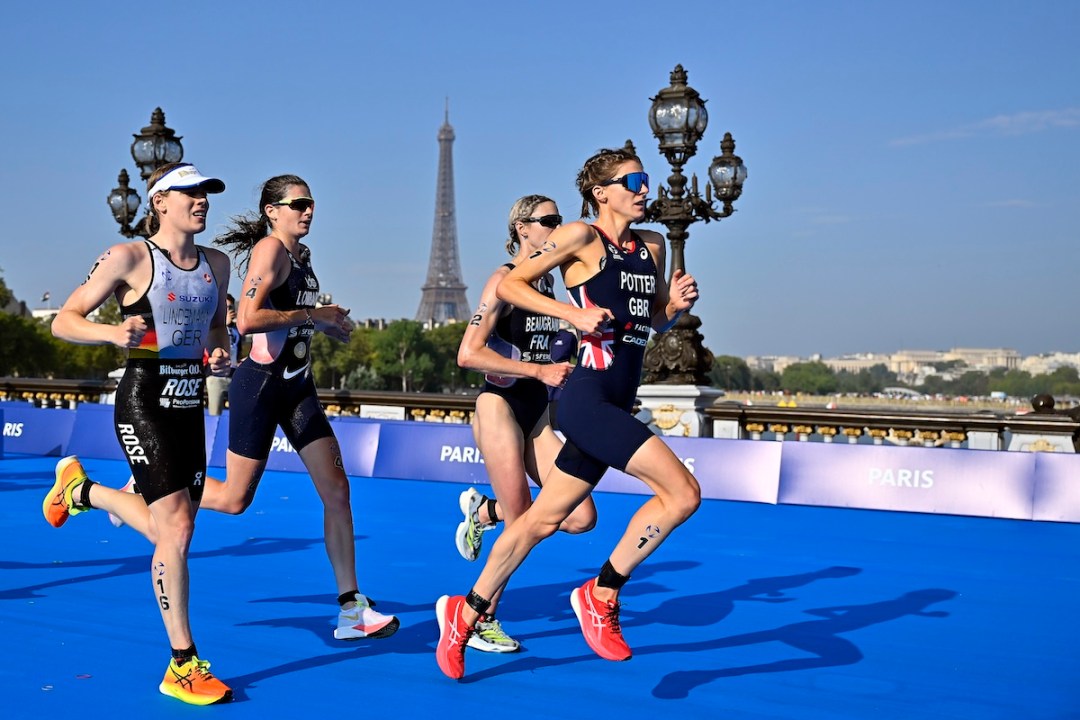 L-R: Laura Lindermann, Emma Lombardi, Cassandre Beaugrand and Beth Potter compete on Pont Alexandre III in front of the Eiffel tower during the Women World Triathlon on August 17, 2023 in Paris, France.
