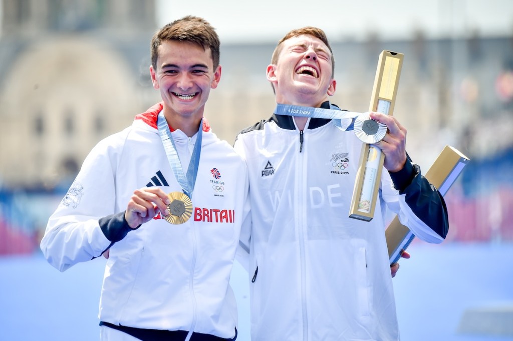 Alex Yee and Hayden Wilde celebrate winning gold and silver in the 2024 Paris Olympic triathlon men's race