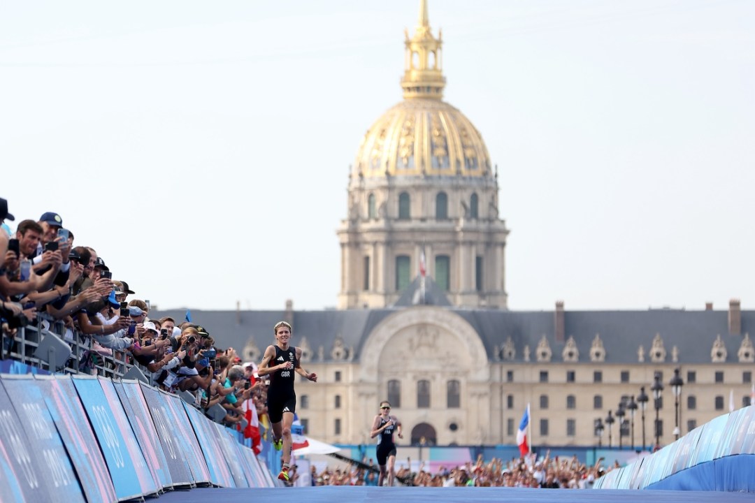 Beth Potter of Team Great Britain runs to the finish line to win the bronze medal in Women's Individual Triathlon on day five of the Olympic Games Paris 2024 at Pont Alexandre III on July 31, 2024 in Paris, France.