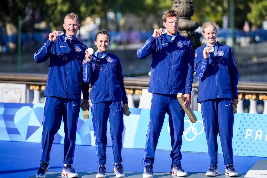 Morgan Pearson of USA, Taylor Knibb of USA, Taylor Spivey of USA, Seth Rider of USA celebrating silver medal during the medal ceremony after competing in the Mixed Relay during Day 10 of Triathlon - Olympic Games Paris 2024 at Pont Alexandre III on August 5, 2024 in Paris, France