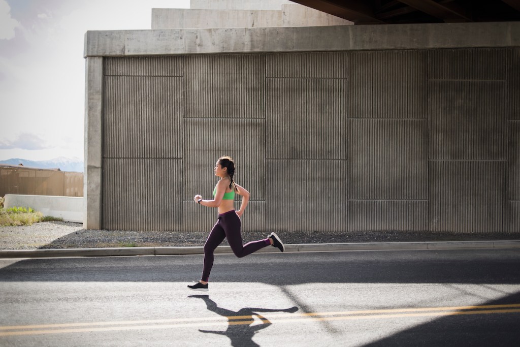 Woman running at tempo pace