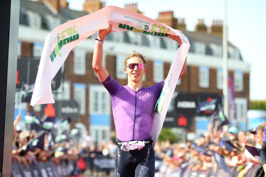 Pro cyclist Lewis Askey takes the tape at Ironman 70.3 Weymouth