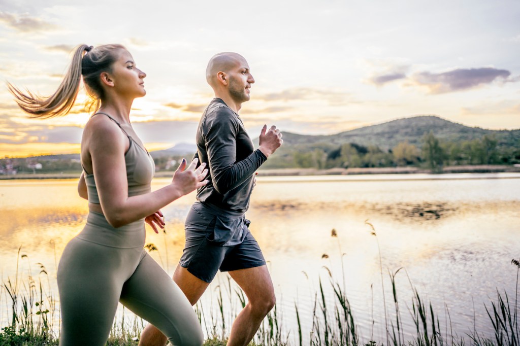 Man and woman running a negative split