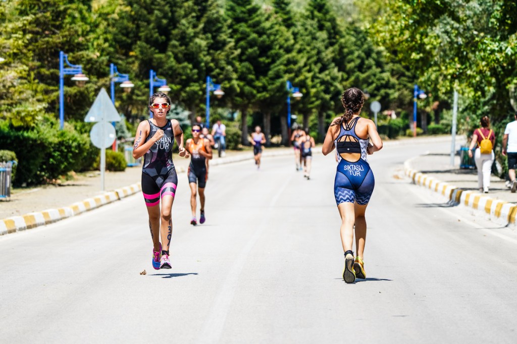 Person running a negative split in a triathlon