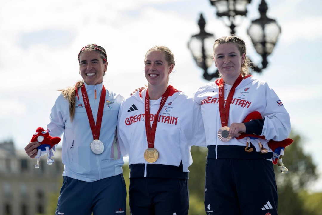 Team GB's Megan Richter (centre) and Hannah Moore (right) celebrate winning gold and bronze, respectively, in the women's PTS4 category at the 2024 Paris Paralympic Games