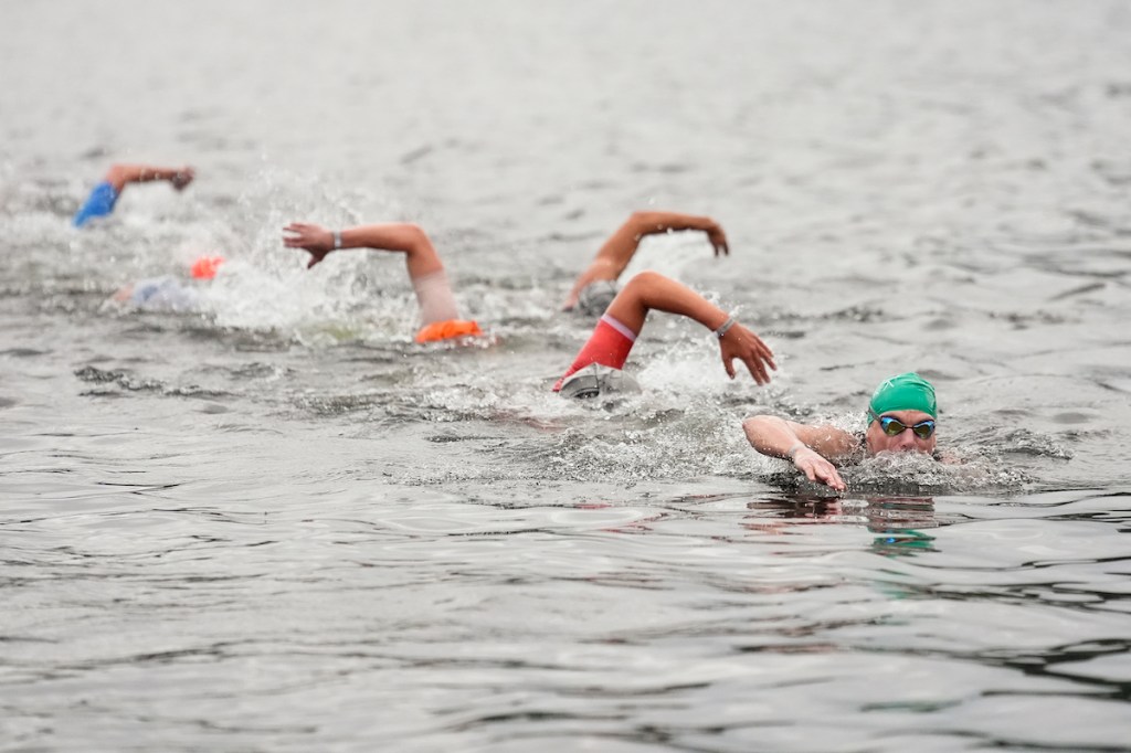 Athletes swimming in Ironman Lake Placid