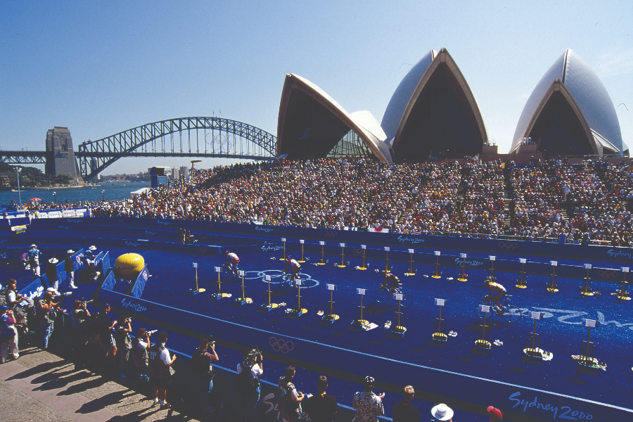 Triathletes cycle during the first Olympic triathlon at Sydney 2000