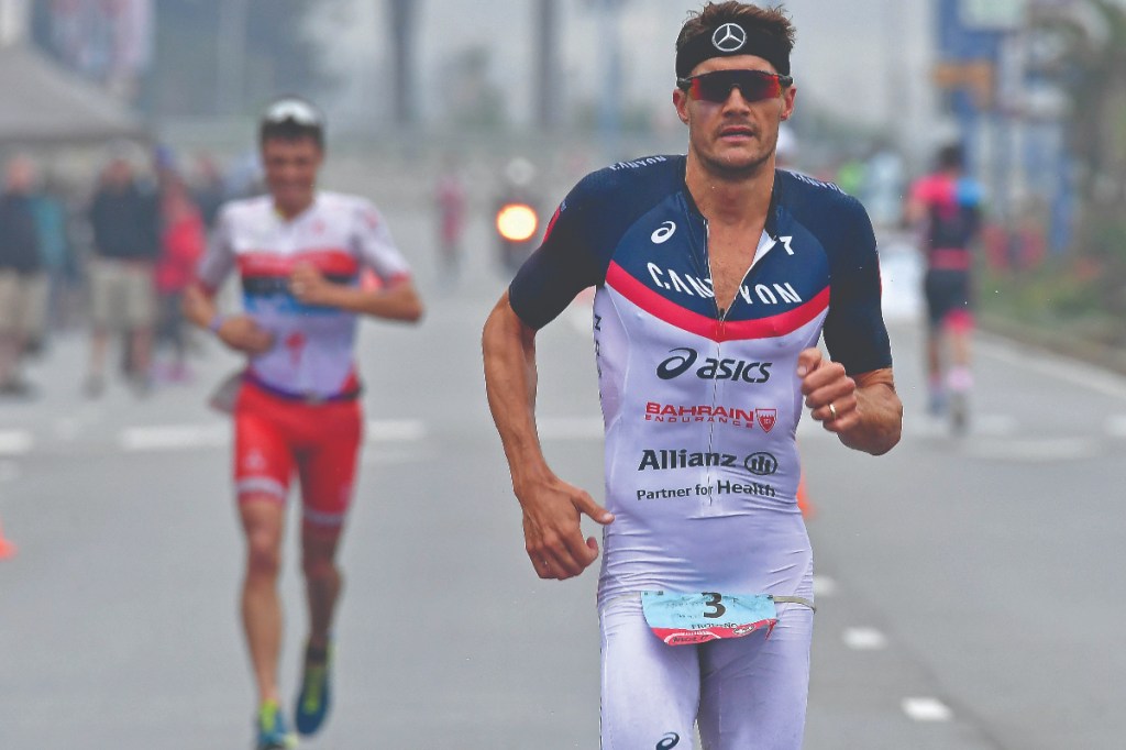 Jan Frodeno leads Javier Gomez at the Ironman 70.3 Worlds in Port Elizabeth, South Africa