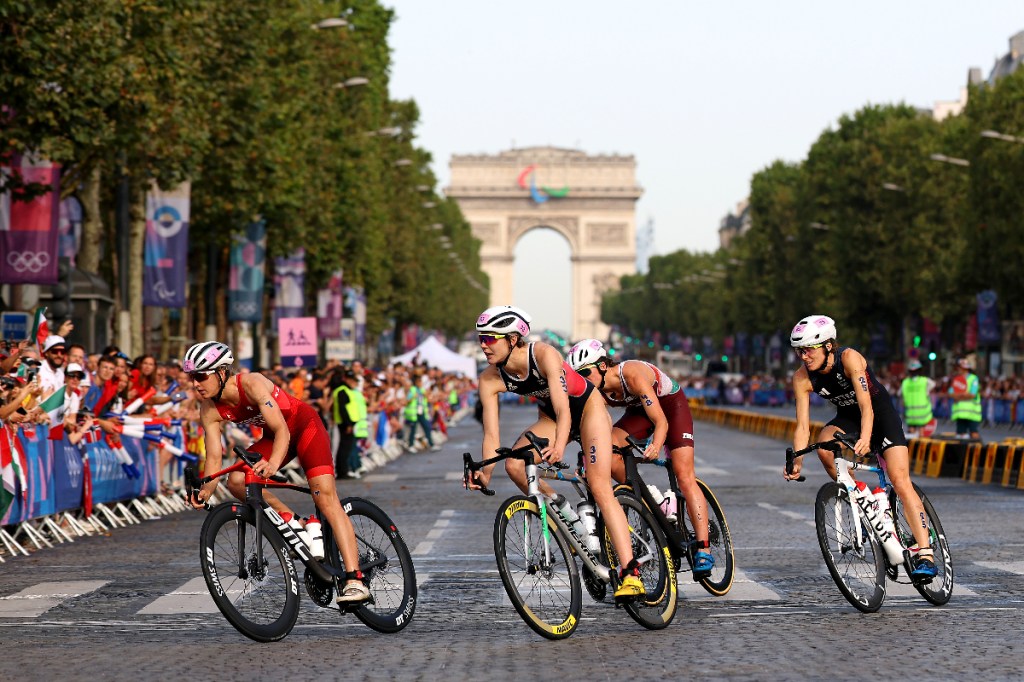 Cassandre Beaugrand corners on bike on the Champs Elysees