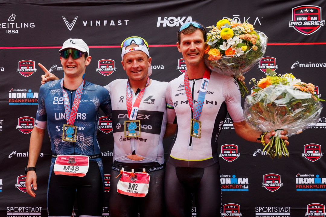 Kieran Lindars (left) celebrates his second place finish in Ironman Frankfurt alongside race winner Kristian Blummenfelt (Pic credit: Jan Hetfleisch/Getty Images for Ironman)