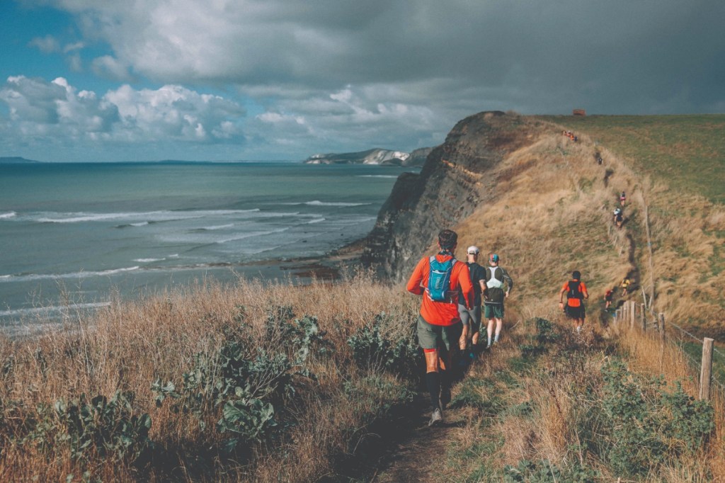 Runners on coastal path