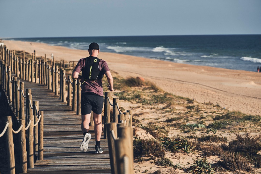 Man running along boardwalk